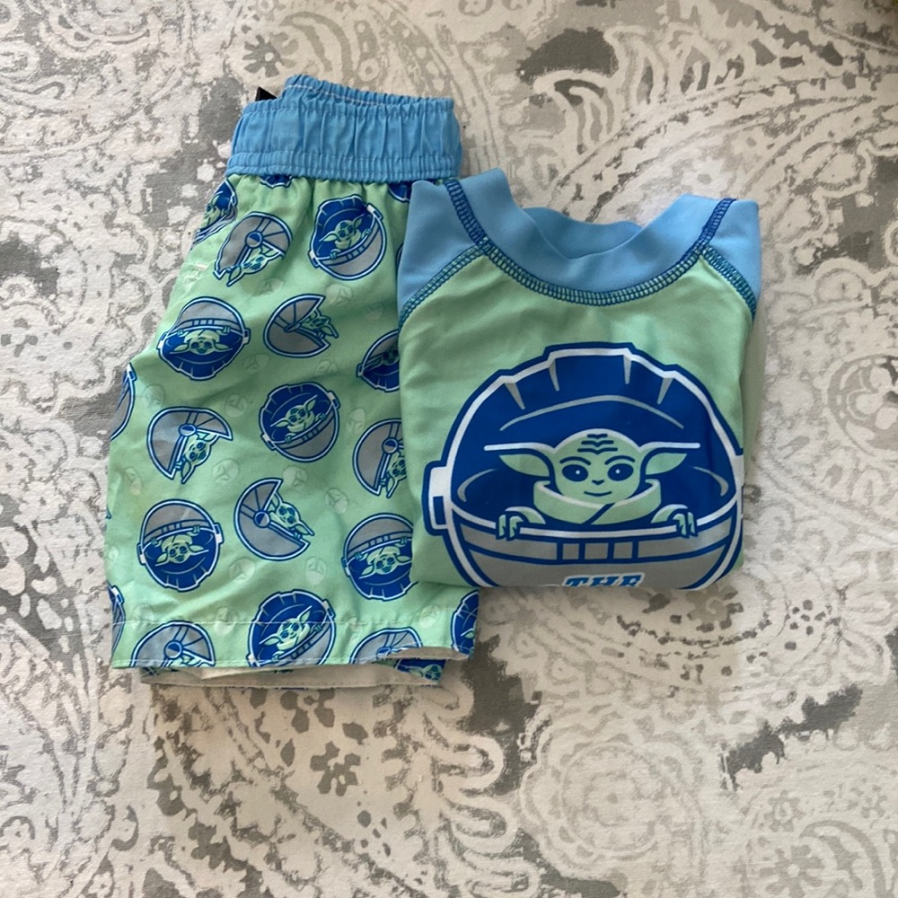 Star Wars baby Yoda swim trunks and water shirt.